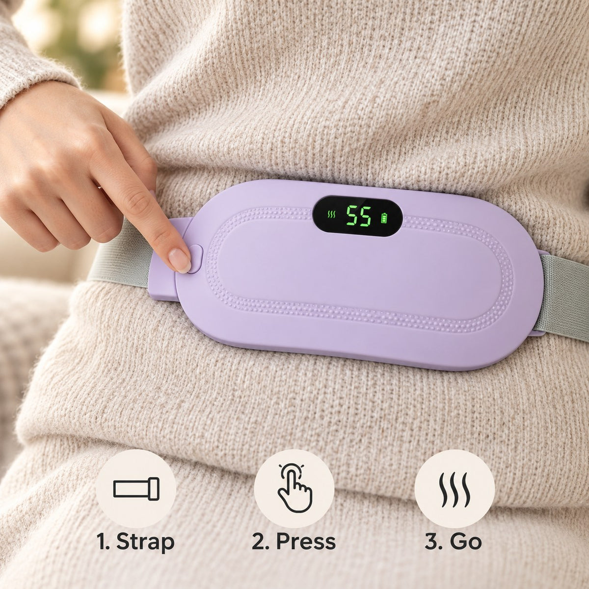 A finger pressing the single button on the heat belt, display showing the heat level